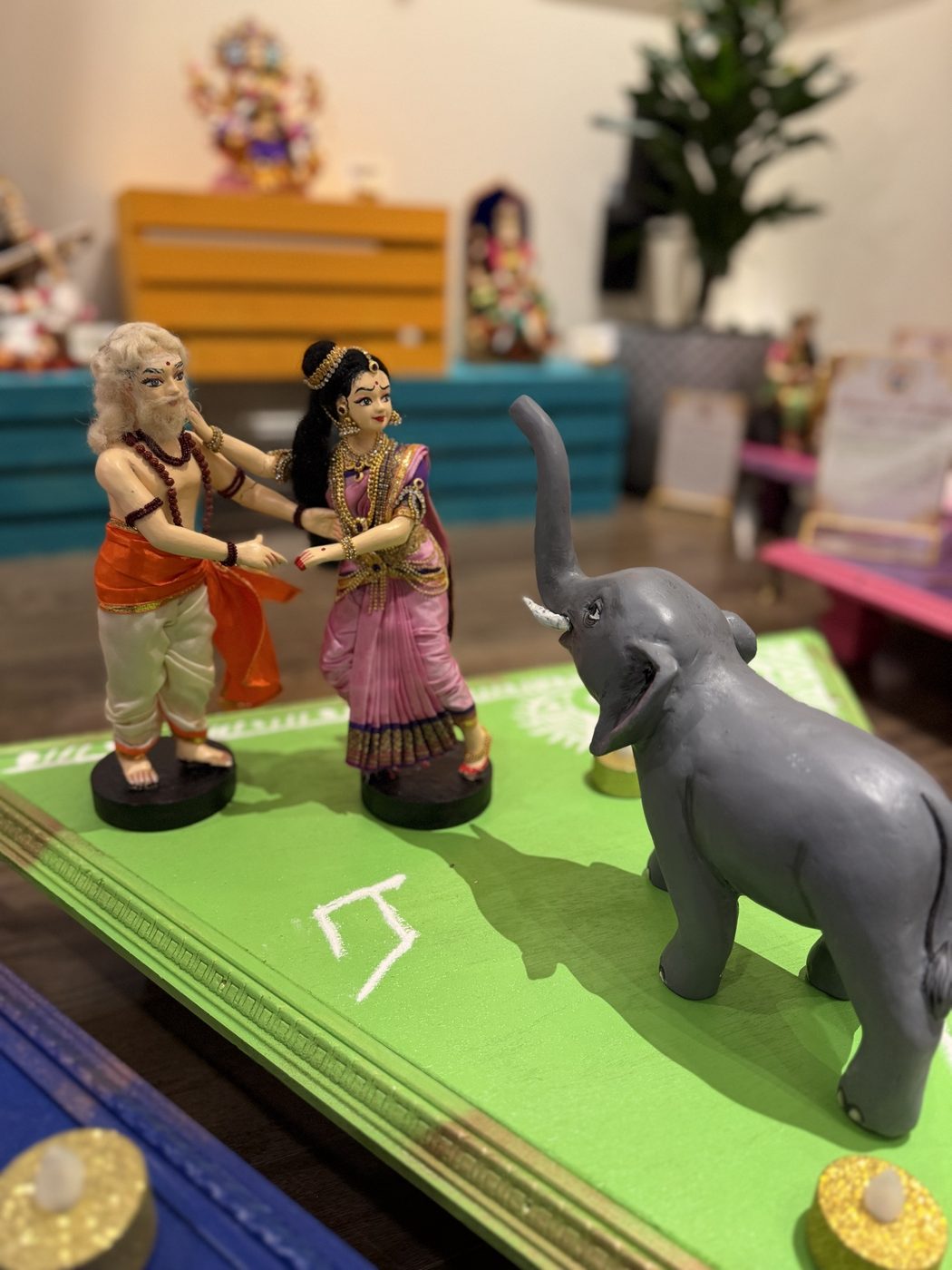 Golu dolls of Valli running to the old sage as a wild elephant charges
